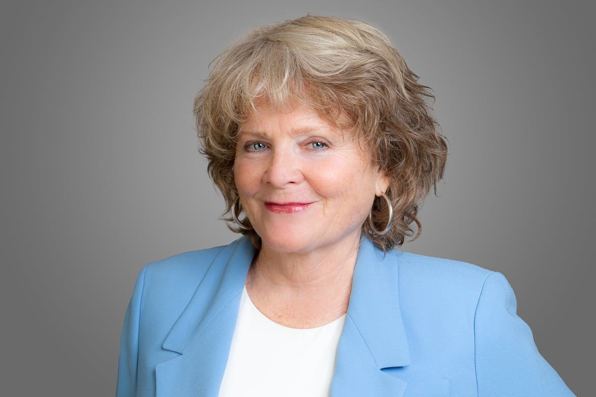 Kathleen Soldati, Principal of Soldati PR, smiling in a light-blue blazer